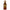 Caramel Dusk Extrait De Parfum Premium Collection by Royale Noir – Elegant Fragrance in Transparent Brown Bottle With Gold Label And Gold Crown Cap.