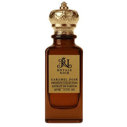 Caramel Dusk Extrait De Parfum Premium Collection by Royale Noir – Elegant Fragrance in Transparent Brown Bottle With Gold Label And Gold Crown Cap.