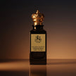 A black perfume bottle labelled 
