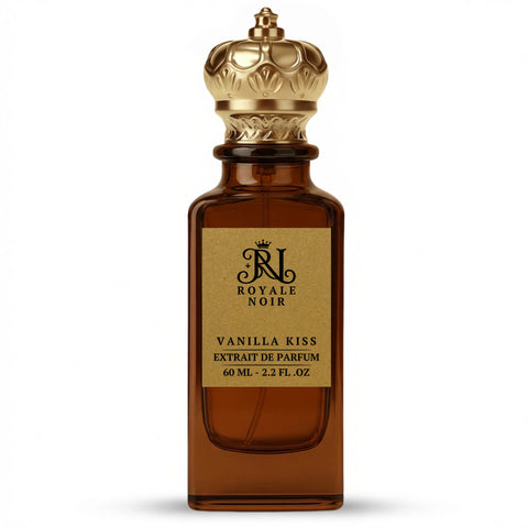 Vanilla Kiss Extrait De Parfum by Royale Noir – Elegant Fragrance in Transparent Brown Bottle With Gold Label And Gold Crown Cap.
